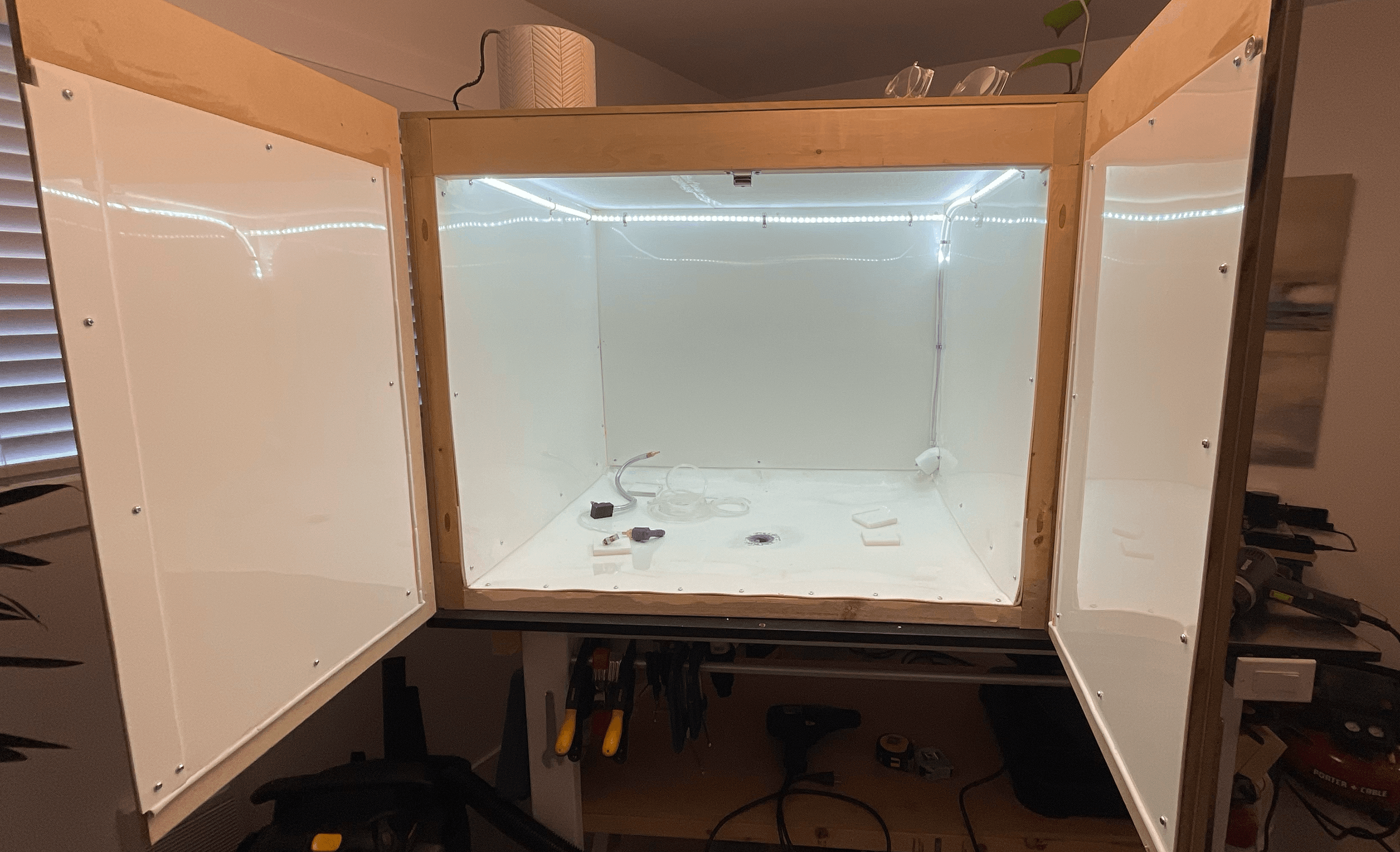 Enclosure with plastic interior for liquid drainage